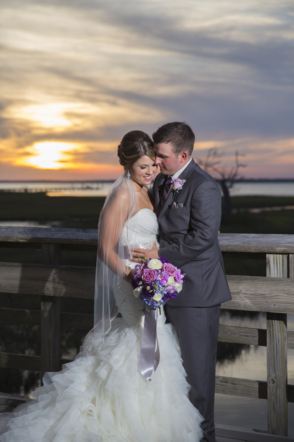 Sunset picture of bride and groom at NC Aquarium in Pine Knoll Shores